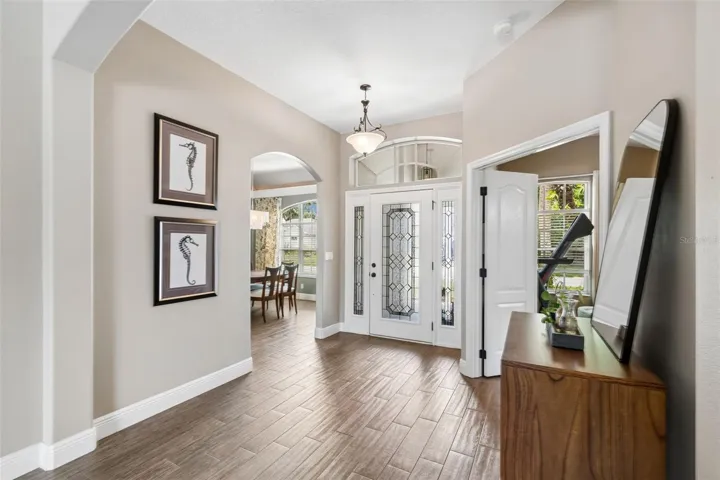 Leaded glass entry door and sidelights fill the foyer area with natural light
