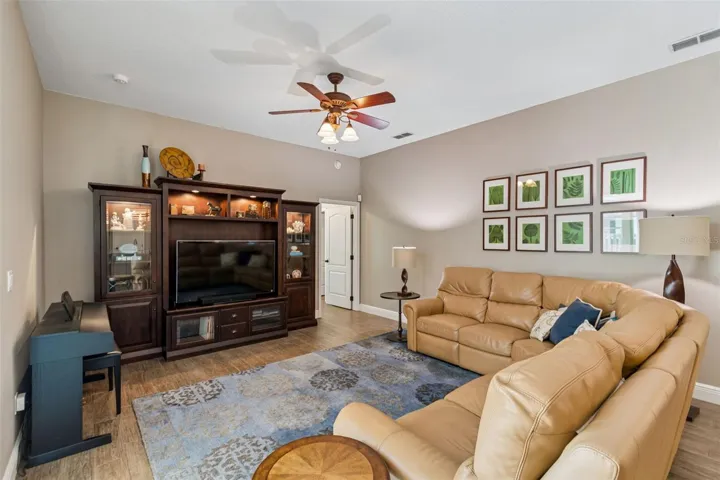 Just through the doorway of the family room is the 4th bedroom and 3rd full bathroom with pool access