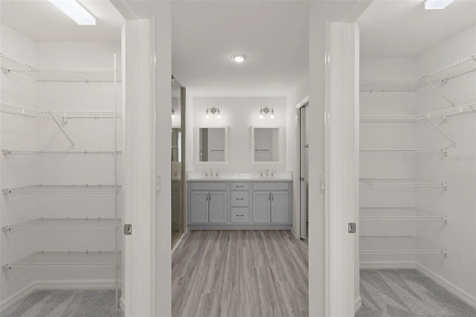 Primary Bath with a Walk-in Closet on each side