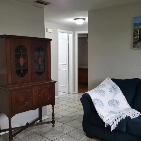 Living room moving towards hallway - linen closet, Bath & 2 BR's
