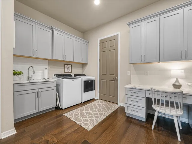 Washer/Dry and Wash Sink, 8 Ft. Door leads to the Garage