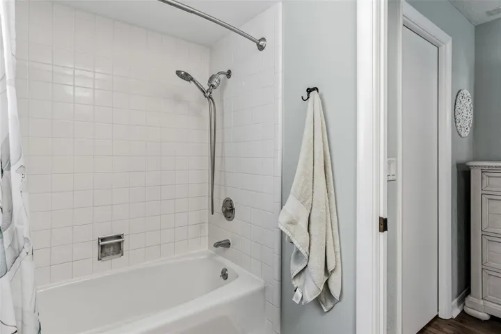 En-suite bathroom with shower/tub combo.