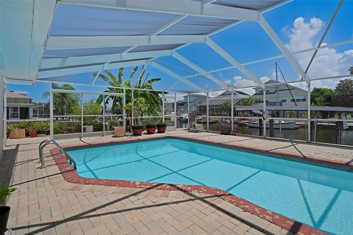 Sparkling Screened Pool Overlooking Canal
