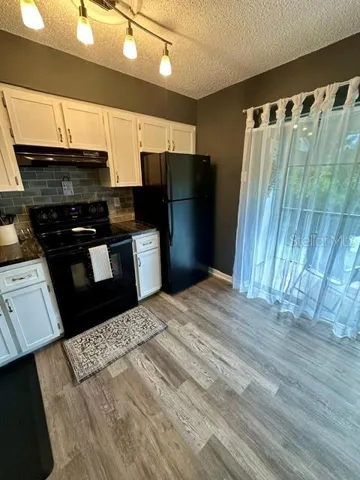 Kitchen with view out to balcony