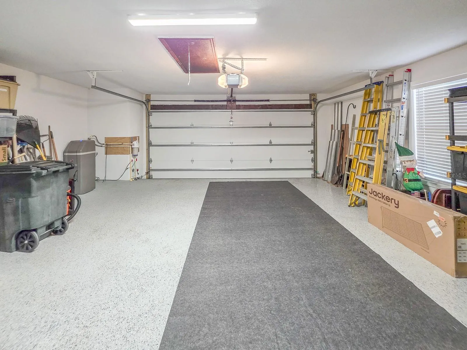 R-19 insulated garage door, Epoxy floor, whole home water filtration & water softener.