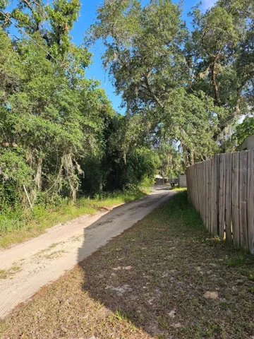 Street view to the left past the back gate entrance on 196th Terr