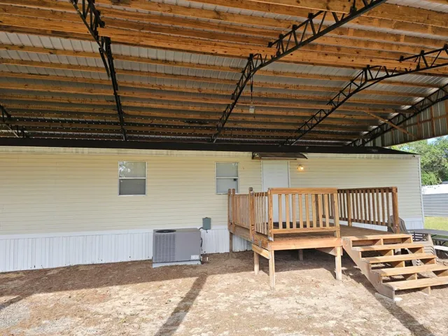 Front of home with AC unit next to front porch