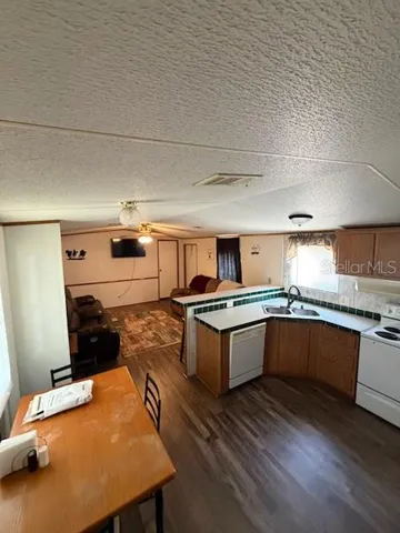 Great room from front porch entrance. kitchen, dining area and living room