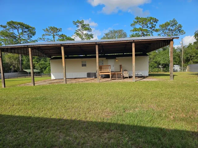 Front of Home, with Horse Turnout to left and back gate to the right of home