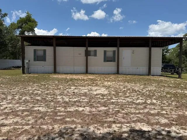 Back view of home under the pole barn