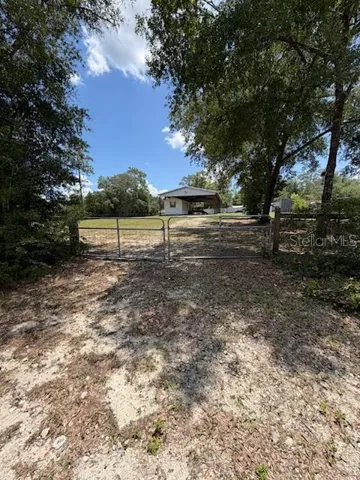 Looking at the property from the gated entrance off SE 90th Place