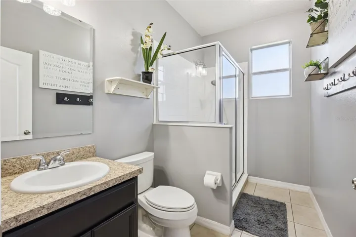 One of three full baths adds convenience and makes the floor plan work better for guests and daily use.