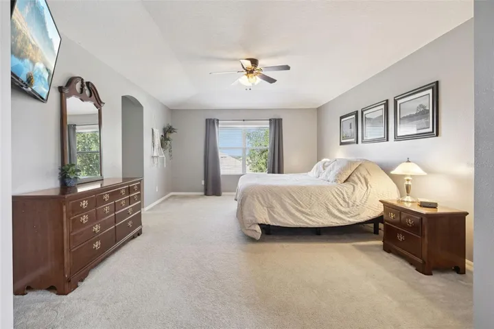 The spacious primary suite offers room for more than just furniture—it delivers a true retreat.