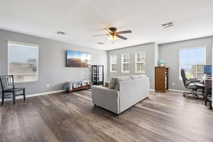 The upstairs bonus room gives buyers the extra flex space they keep wanting but rarely find.