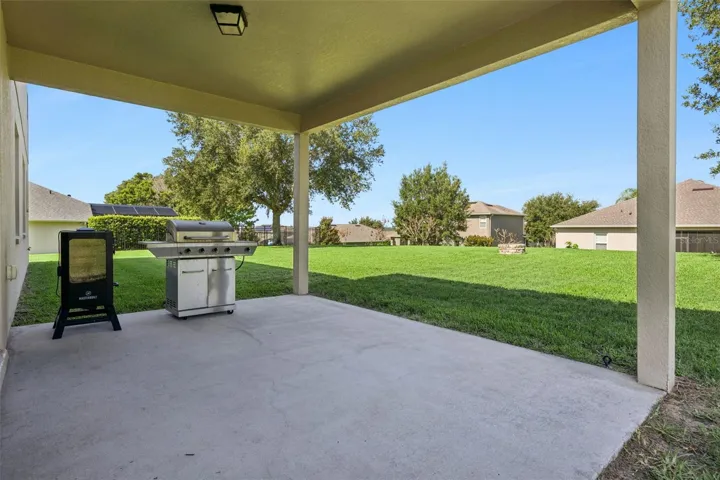 The covered rear porch extends the living space outdoors and adds another usable everyday zone.