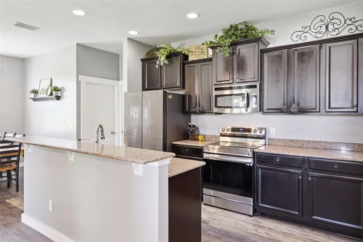 The kitchen stays connected to the main living spaces, making it ideal for daily life and entertaining.