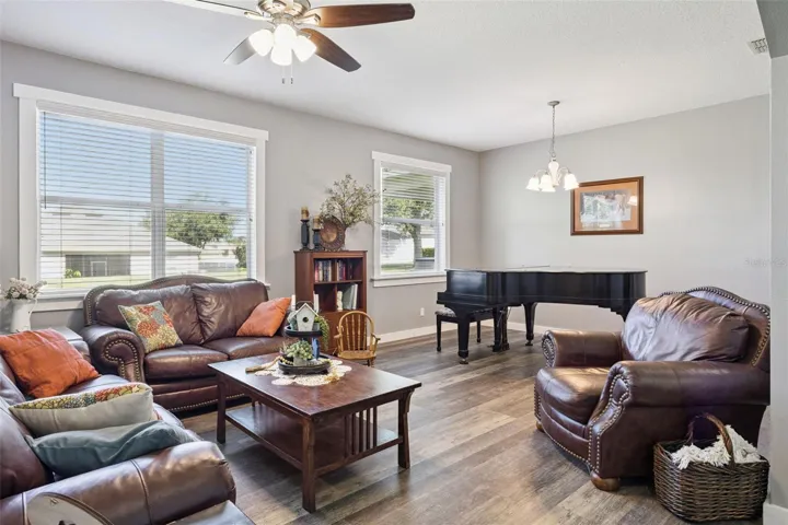 An additional living area adds flexibility for a music room, sitting room, playroom, or office setup.