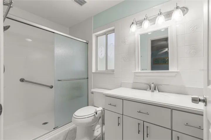 PRIMARY BATH. SHOWER HAS A BENCH SEAT.