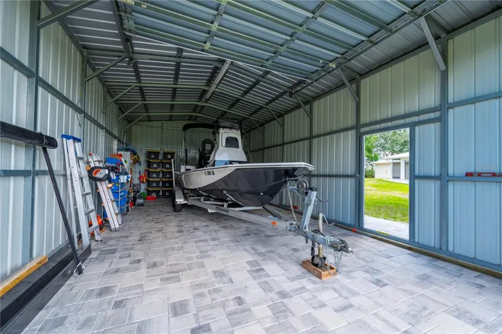 This is a 22' Blue Wave boat that fits well inside. It's negotiable too!