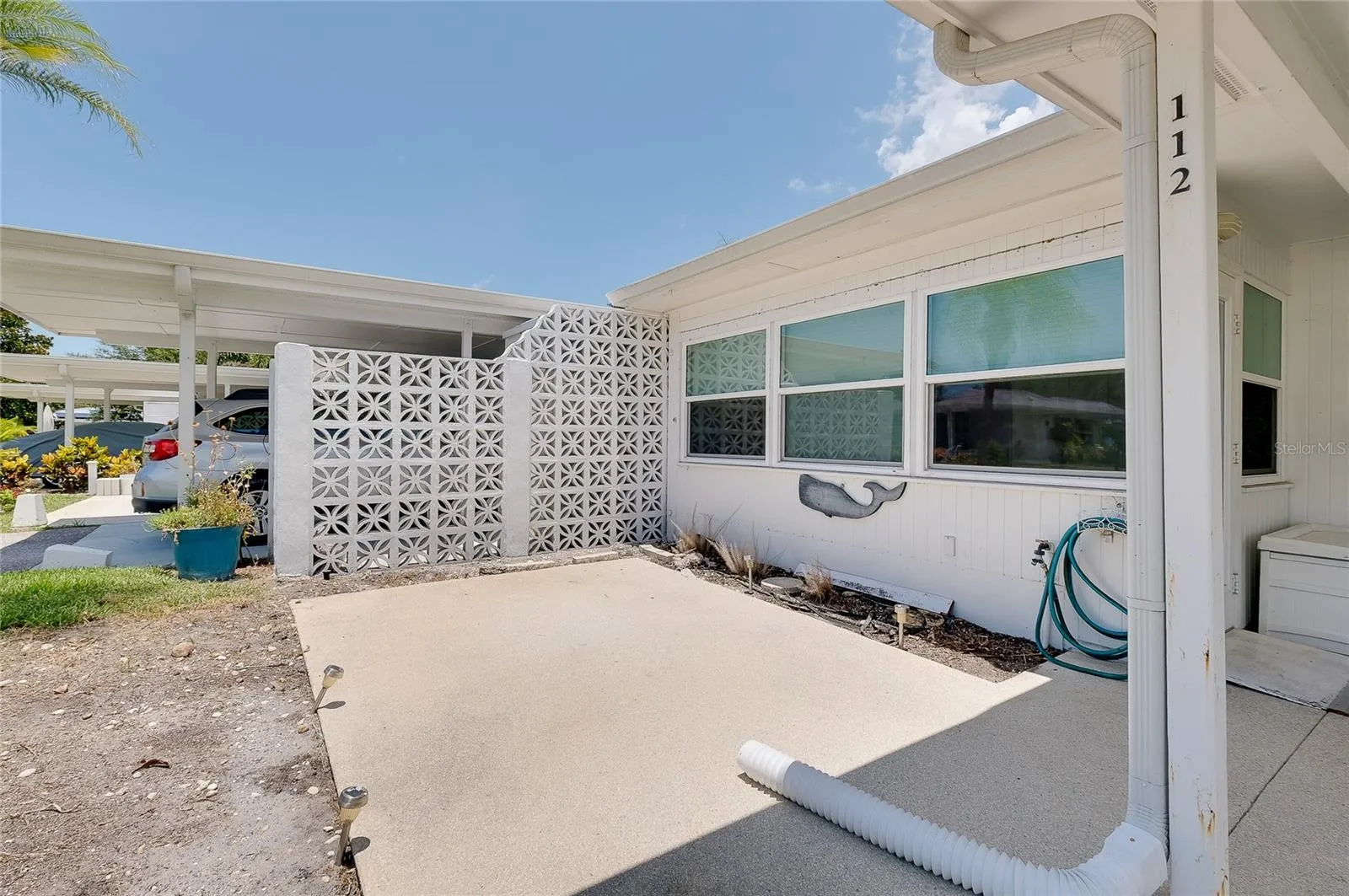 Patio area off Florida room and adjacent to carport