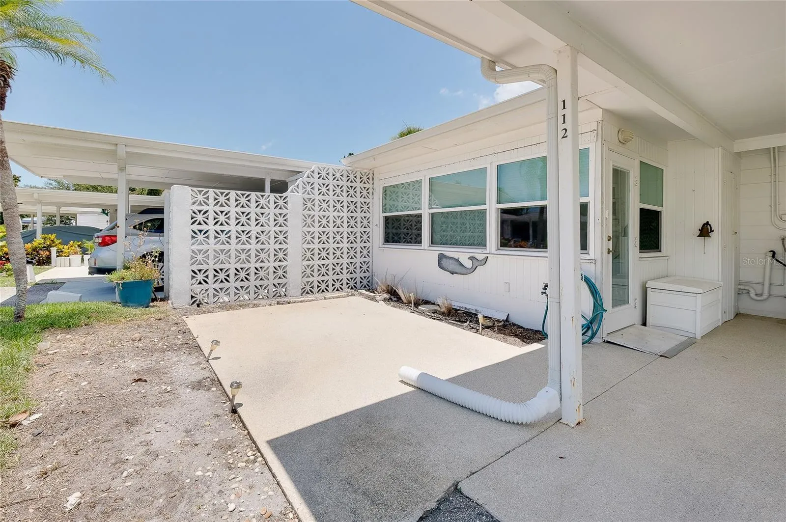 Patio area off Florida room and adjacent to carport