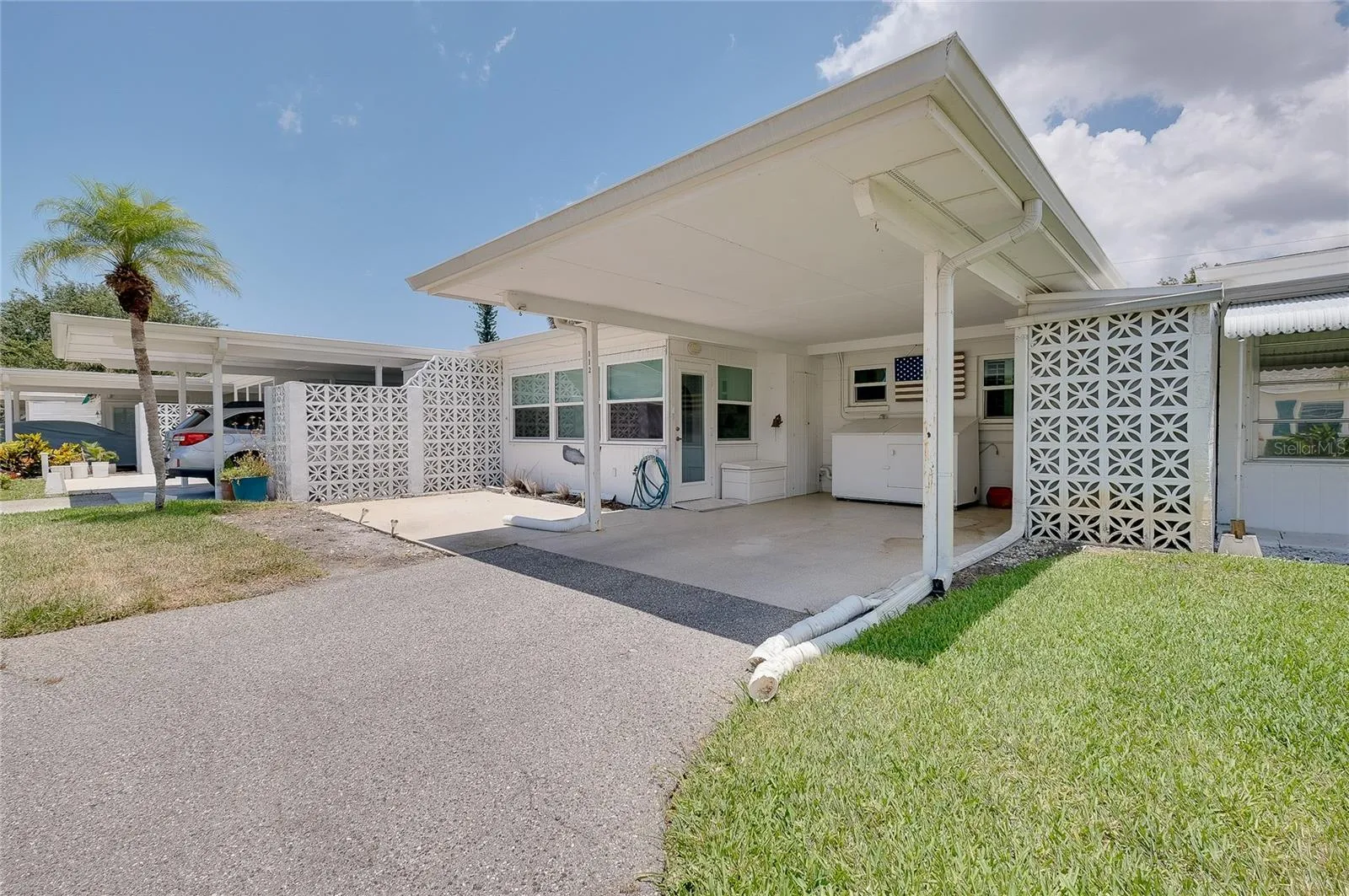 Carport and patio are to the rear of the villa.