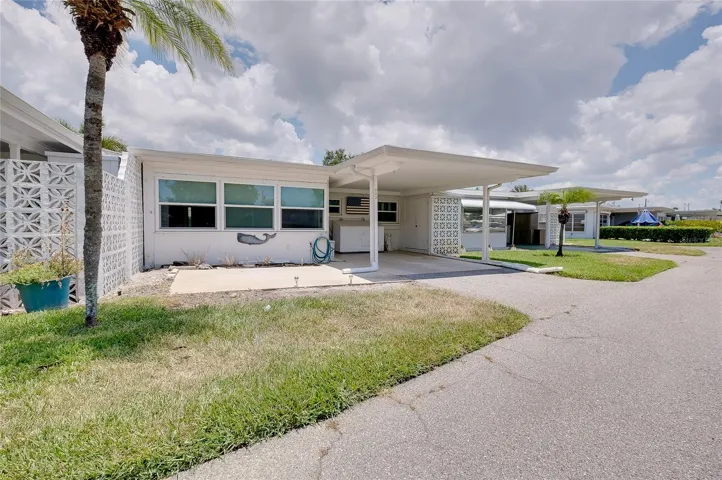 Carport and patio are to the rear of the villa.
