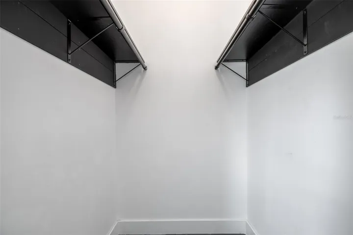 Primary bedroom walk-in closet