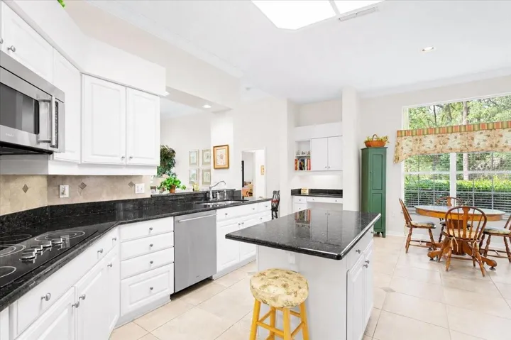 Stainless steel appliances and granite countertops & island