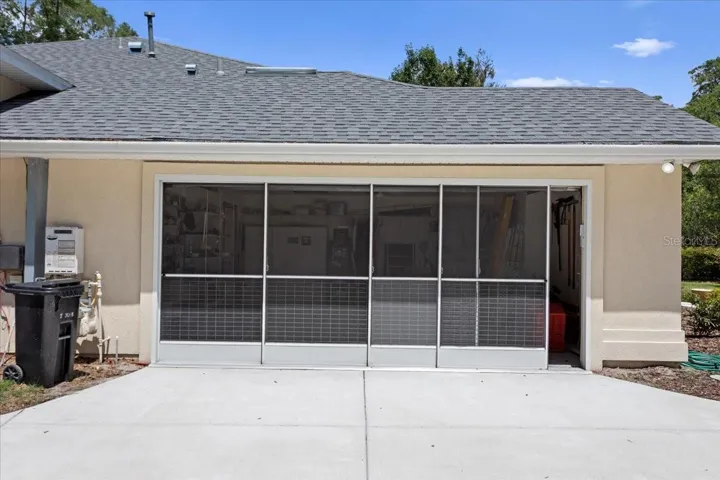 Screened garage door