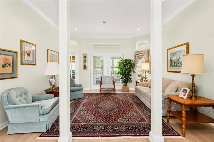 Formal living room with dramatic column features