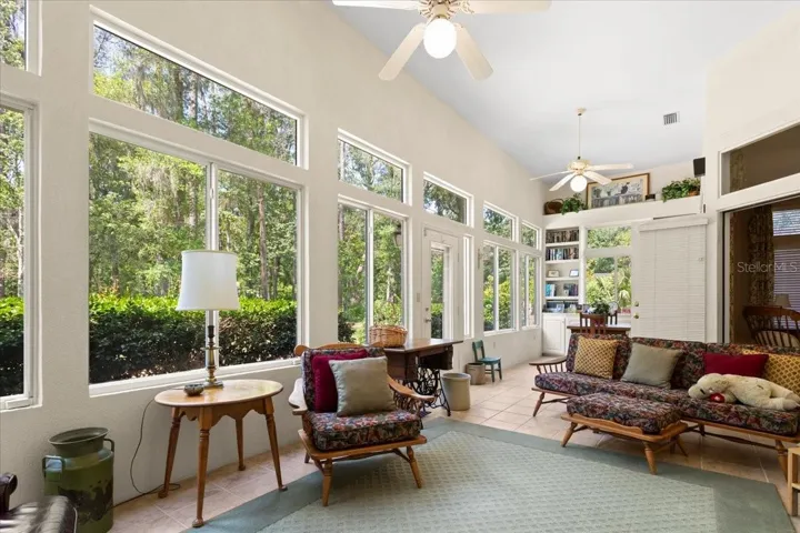Sunny Florida Room with beautiful expansive windows