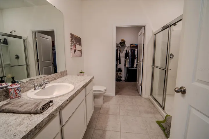 En-Suite Bathroom with walk in shower and walk in closet. Pictures taken before the sellers moved out of home.