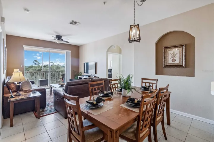 Open floor plan showing dining, living and balcony.