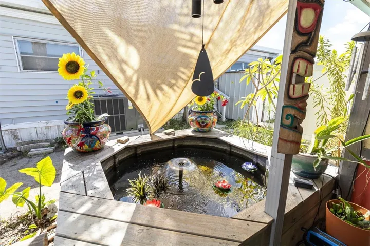 Koi Pond area under the carport breezeway. Next to the seating area.