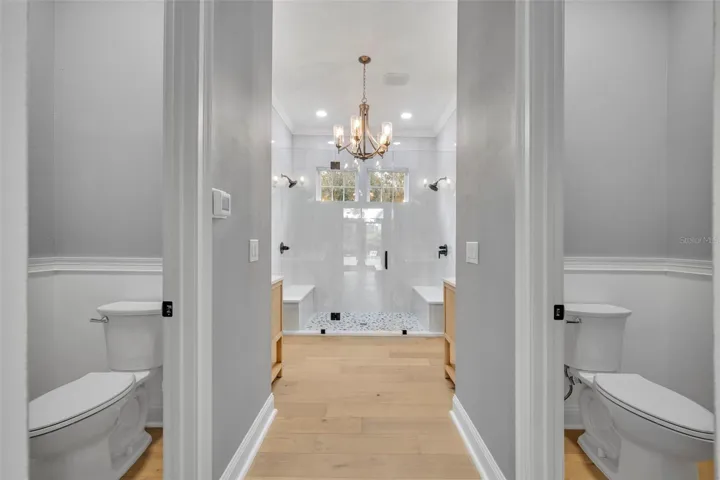 First Floor Primary Bathroom duel toilet closets enclose