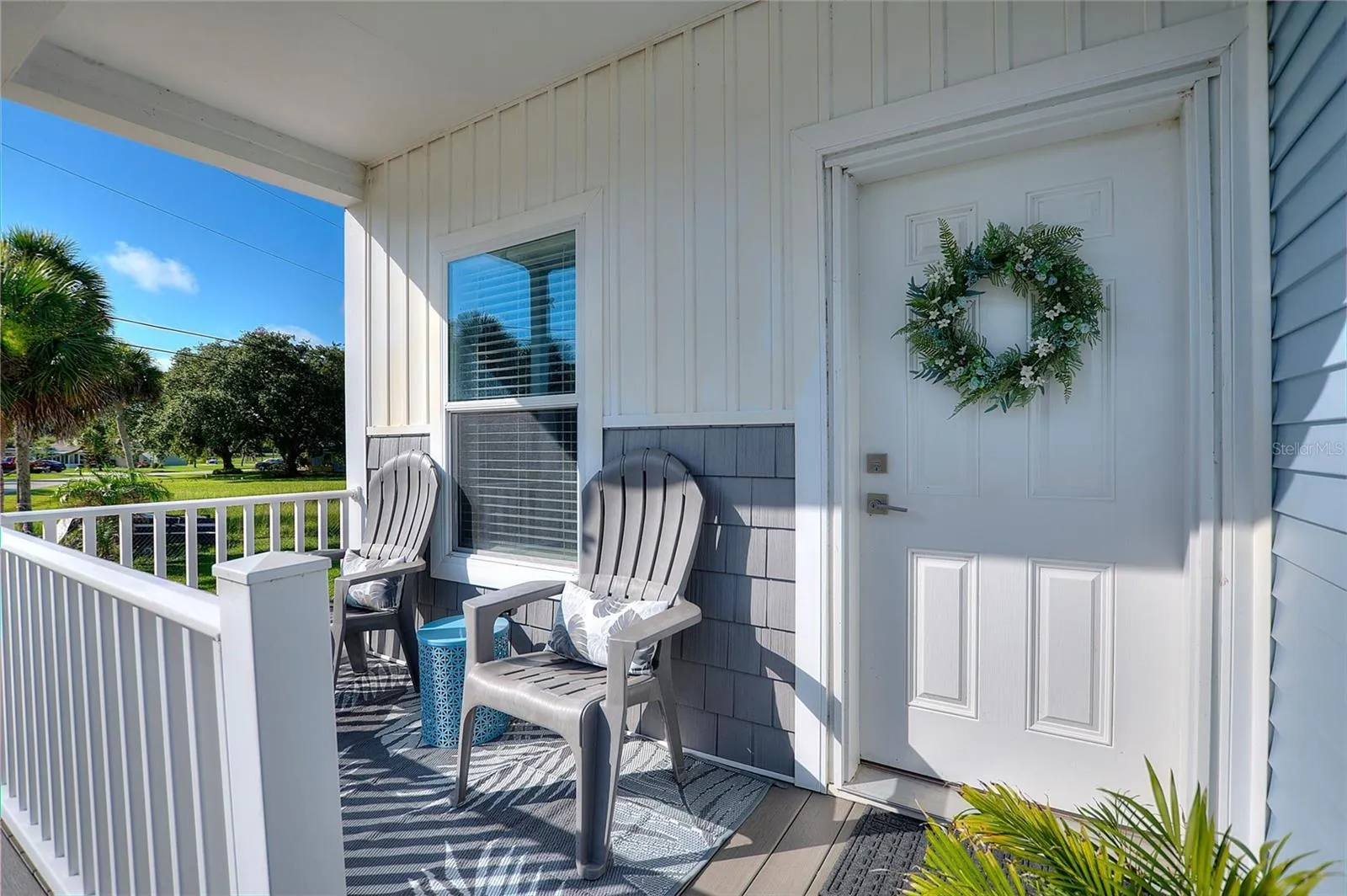 Relax, unwind and enjoy Florida lifestyle on the covered front patio