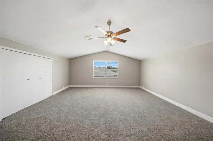 Upstairs bonus room with closet and half bathroom