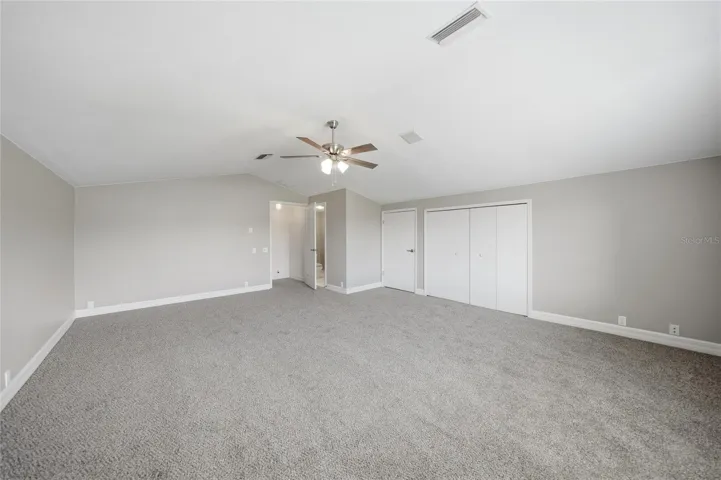 Upstairs bonus room with closet and half bathroom