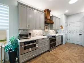 Kitchen with induction stove, lots of light and space for food prep.
