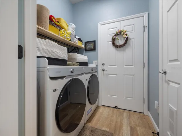 Laundry room with storage.