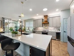 Kitchen has big island for entertaining, dining and food prep.