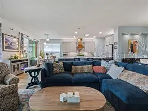 Living room opens to kitchen. The sofa will be different.