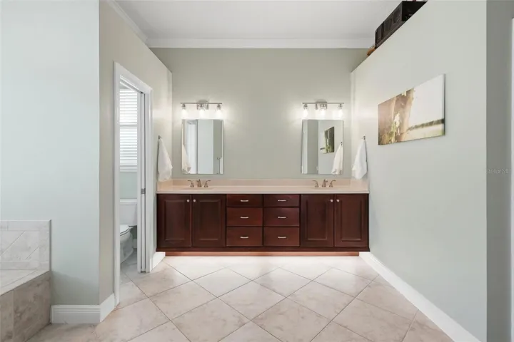 Primary bathroom with dual closets