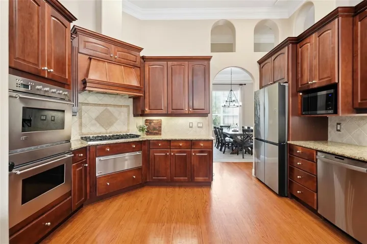 Kitchen with double oven and gas cooktop