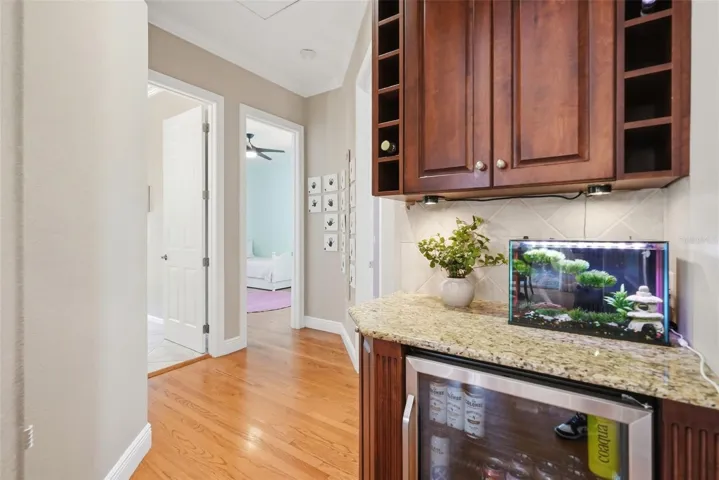 Hallway with bar that goes to bedroom 3 and 4 with full pool bathroom