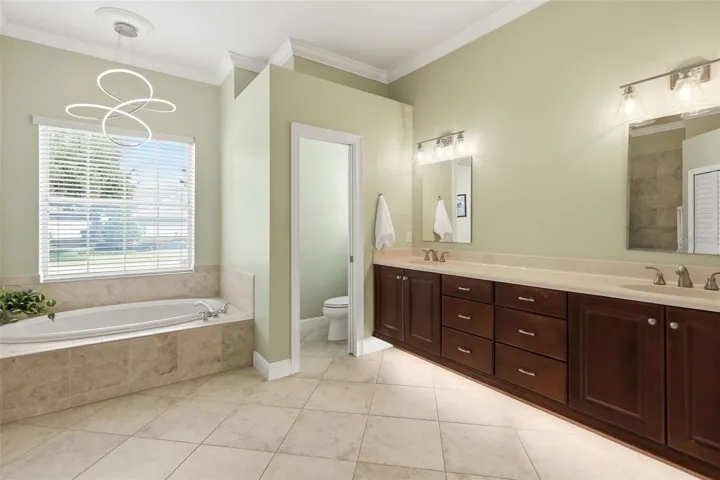 Primary bathroom with dual closets