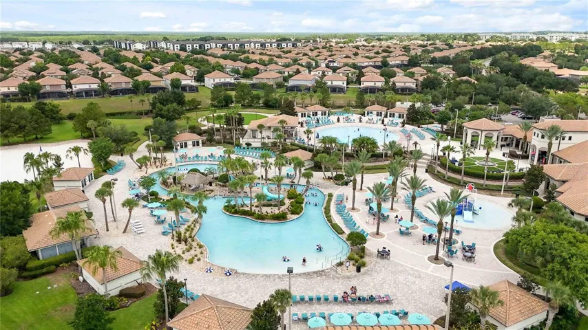 Aerial view of the Oasis Club amenities showcasing resort-style pools, lounge areas, water features, and tropical outdoor spaces for guests to enjoy.