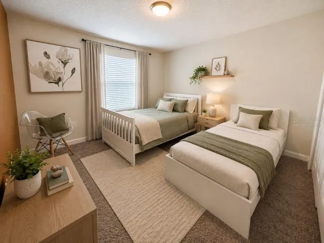 Virtually staged secondary bedroom highlighting a bright, comfortable two-bed layout perfect for guests, family, or short-term rental use.
