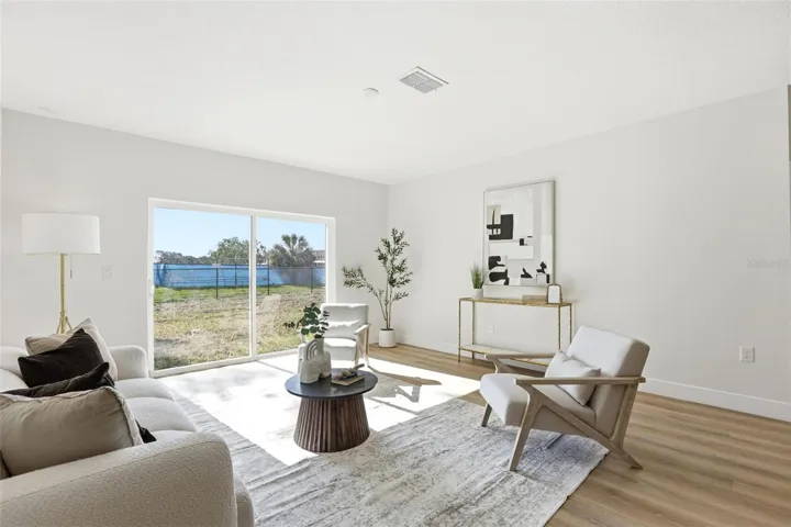 Open concept living area designed for comfortable everyday living and easy furniture placement.